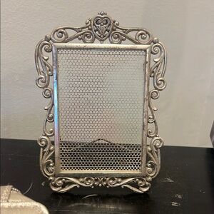 Brighton silver ear ring holder.